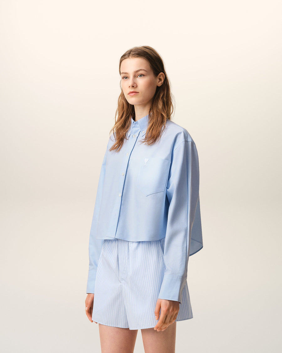 Blue cropped cotton shirt with embossed Ami de Coeur